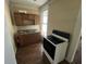 Functional kitchen equipped with a cooktop range and wooden cabinetry, ready for culinary adventures at 1153 Villa Ave, Indianapolis, IN 46203