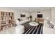 Virtual staging showcases finished basement living space at 11708 Rolling Springs Dr, Carmel, IN 46033