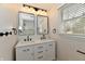 Updated bathroom with double sink vanity, marble countertop, and black accents at 11708 Rolling Springs Dr, Carmel, IN 46033