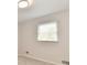 A sunlit room featuring neutral walls, plush carpeting, and a window with blinds at 11708 Rolling Springs Dr, Carmel, IN 46033