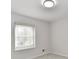 Bright room with neutral walls, plush carpet, a large window with blinds, and modern ceiling lighting at 11708 Rolling Springs Dr, Carmel, IN 46033
