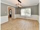 Dining room with modern light fixture, and large window at 11708 Rolling Springs Dr, Carmel, IN 46033