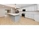 Bright kitchen features an island, stainless steel appliances, and ample counter space at 11708 Rolling Springs Dr, Carmel, IN 46033