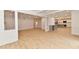 Spacious living room featuring a coffered ceiling, hardwood floors, and an open layout to the kitchen at 11708 Rolling Springs Dr, Carmel, IN 46033