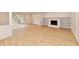 Living room featuring a fireplace, built-in shelving, hardwood floors, and sliding glass doors at 11708 Rolling Springs Dr, Carmel, IN 46033