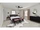 Stylishly staged main bedroom with a comfortable bed, modern decor, and abundant natural light at 11708 Rolling Springs Dr, Carmel, IN 46033