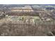 Distant aerial view of the property highlighting its secluded, wooded setting at 1194 S 300 E, Anderson, IN 46017