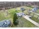 An aerial view showing the roof line, lawns and outbuildings on the property at 1194 S 300 E, Anderson, IN 46017