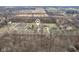 Distant aerial view of the property highlighting its secluded, wooded setting at 1194 S 300 E, Anderson, IN 46017