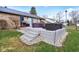 View of the patio, outdoor seating, and black fence surrounding the back yard at 1194 S 300 E, Anderson, IN 46017