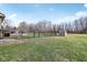 The backyard boasts a large green yard, metal fence and shed for extra storage at 1194 S 300 E, Anderson, IN 46017
