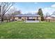 This backyard has a metal fence, hot tub and a large green yard at 1194 S 300 E, Anderson, IN 46017