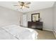 This bedroom features a ceiling fan, dresser with mirror, and neutral walls at 1194 S 300 E, Anderson, IN 46017