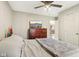 This bedroom has a dresser with television, ceiling fan, and neutral walls at 1194 S 300 E, Anderson, IN 46017