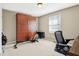 This bonus room has a murphy bed, television and a bright window at 1194 S 300 E, Anderson, IN 46017