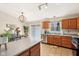 Bright kitchen with wood cabinets, stainless appliances, and sliding door to the backyard at 1194 S 300 E, Anderson, IN 46017