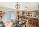 Bright kitchen with stainless appliances, wood cabinets, and a dining area with a sliding door at 1194 S 300 E, Anderson, IN 46017
