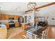Eat-in kitchen with wood cabinets, stainless appliances, and view of the living room at 1194 S 300 E, Anderson, IN 46017
