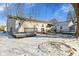 Backyard with gray siding, patio deck, and snow on the ground at 1196 S Vinewood Ave, Indianapolis, IN 46241