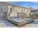 Backyard with gray siding, patio deck, and some snow on the ground at 1196 S Vinewood Ave, Indianapolis, IN 46241
