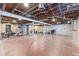 Unfinished basement with exposed ceiling and support beams at 1196 S Vinewood Ave, Indianapolis, IN 46241