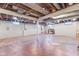 Unfinished basement with exposed ceiling and support beams at 1196 S Vinewood Ave, Indianapolis, IN 46241