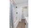 Bathroom with tub and floral shower curtain at 1196 S Vinewood Ave, Indianapolis, IN 46241