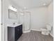 Bathroom featuring a vanity with black hardware and a glass-enclosed shower at 1196 S Vinewood Ave, Indianapolis, IN 46241