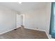 Bedroom with hardwood floors, neutral paint, and natural light at 1196 S Vinewood Ave, Indianapolis, IN 46241