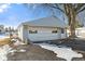Detached garage with white door, surrounded by mature trees at 1196 S Vinewood Ave, Indianapolis, IN 46241