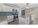Contemporary kitchen featuring stainless steel appliances, white cabinets, and granite countertops at 1196 S Vinewood Ave, Indianapolis, IN 46241
