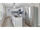 Modern kitchen with white cabinets, granite countertops, and stainless steel appliances at 1196 S Vinewood Ave, Indianapolis, IN 46241