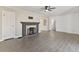Comfortable living room featuring gray floors, a decorative fireplace, and neutral paint at 1196 S Vinewood Ave, Indianapolis, IN 46241