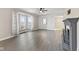 Spacious living room featuring a fireplace, large bay window, and stylish gray flooring at 1196 S Vinewood Ave, Indianapolis, IN 46241