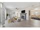 Bright living room with a fireplace, gray flooring and neutral furniture at 1196 S Vinewood Ave, Indianapolis, IN 46241