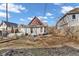 View of backyard featuring a grassy area, garden bed, and a cozy fire pit at 125 Kansas St, Indianapolis, IN 46225