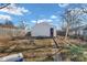 Wide backyard featuring a quaint shed, brick patio, and a garden, perfect for outdoor enjoyment at 125 Kansas St, Indianapolis, IN 46225