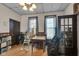 Casual dining room featuring wood floors, a dining table, and natural light from the windows at 125 Kansas St, Indianapolis, IN 46225