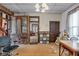 The dining room features wood floors and an ornate hutch at 125 Kansas St, Indianapolis, IN 46225