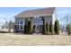 Back view of home featuring a patio, well-maintained lawn, and mature landscaping at 12650 Misty Ridge Ct, Fishers, IN 46037