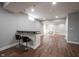 Finished basement featuring a kitchenette bar area, wood-look floors, and recessed lighting at 12650 Misty Ridge Ct, Fishers, IN 46037