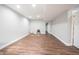 Spacious finished basement with modern floors and ample room for activities or relaxation at 12650 Misty Ridge Ct, Fishers, IN 46037