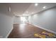 Finished basement with modern flooring and ample lighting, perfect for a recreation or living area at 12650 Misty Ridge Ct, Fishers, IN 46037