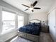 Bright bedroom with a plush bed, large windows for natural light, and a serene atmosphere at 12650 Misty Ridge Ct, Fishers, IN 46037