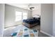 Cozy bedroom featuring a bed with decorative pillows, soft carpet, and neutral wall color at 12650 Misty Ridge Ct, Fishers, IN 46037