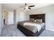 Spacious bedroom featuring a large bed, soft carpeting, and plenty of closet space at 12650 Misty Ridge Ct, Fishers, IN 46037