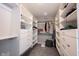 Walk-in closet featuring white shelving and drawers, providing ample storage and organization at 12650 Misty Ridge Ct, Fishers, IN 46037