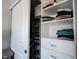 Well-organized closet with shelves and drawers, providing convenient storage and organization solutions at 12650 Misty Ridge Ct, Fishers, IN 46037