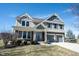 Two-story home featuring a two-car garage, brick accents, and a well-manicured lawn at 12650 Misty Ridge Ct, Fishers, IN 46037