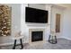 Living room fireplace features a black firebox, tile surround, and custom mantle at 12650 Misty Ridge Ct, Fishers, IN 46037